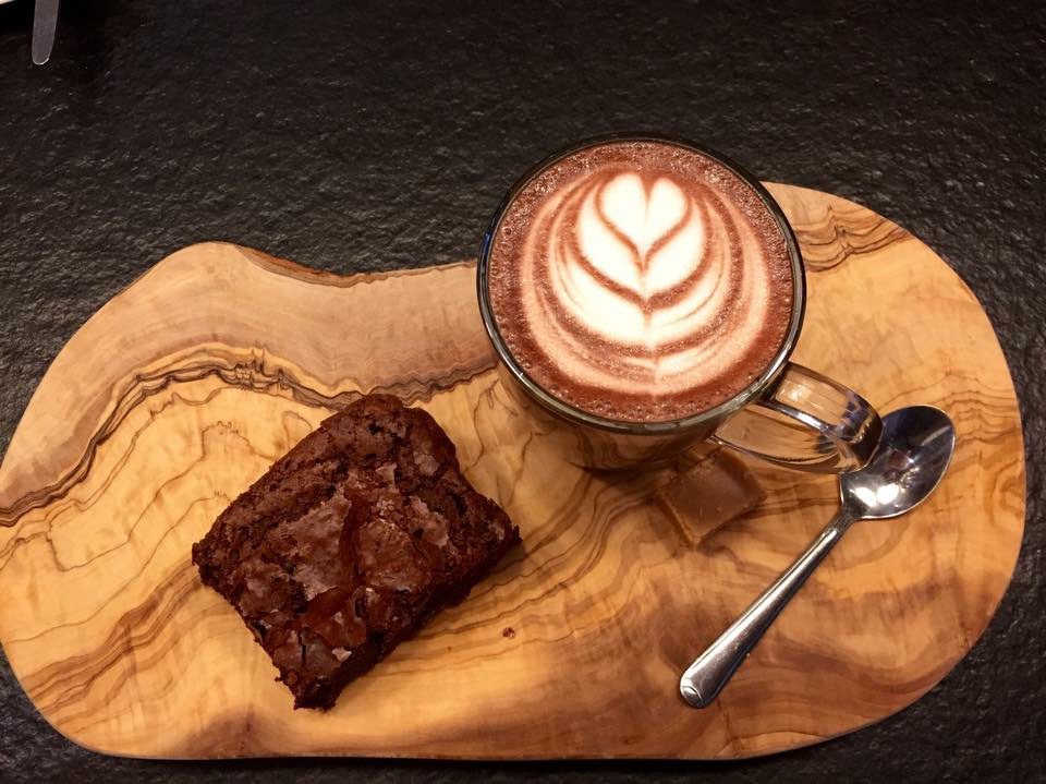 Hot coffee served with chocolate cake